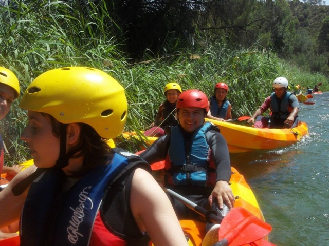  Standing in the canoes next to the reeds 